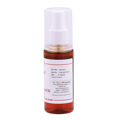 Naturalis Warming Massage Oil 100 ml bottle with product label